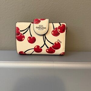 Coach medium Corner Zip wallet in cherry print